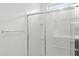 Modern bathroom shower with glass doors and tile surround at 23972 W Cocopah St, Buckeye, AZ 85326
