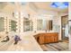 Bathroom with double sinks, vanity mirrors, and a glass-enclosed shower at 25850 S Foxglenn Dr, Sun Lakes, AZ 85248