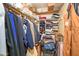 A closet packed with clothes and storage items on shelves at 25850 S Foxglenn Dr, Sun Lakes, AZ 85248
