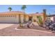 Well maintained front yard with desert landscaping featuring cacti and succulent plants and a terracotta-colored rock cover at 25850 S Foxglenn Dr, Sun Lakes, AZ 85248