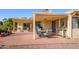 Relaxing brick patio with outdoor seating and desert landscaping at 25850 S Foxglenn Dr, Sun Lakes, AZ 85248