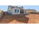 Exterior view of home with spacious backyard, patio area, and potential for landscaping at 2606 E Virginia Cir, Mesa, AZ 85213