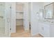 Modern bathroom with a glass-enclosed shower, vanity with marble countertops, and stylish fixtures at 2606 E Virginia Cir, Mesa, AZ 85213