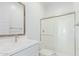 Clean bathroom featuring a glass-enclosed shower and a vanity with white quartz countertops at 2606 E Virginia Cir, Mesa, AZ 85213