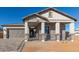 Charming home with a brick facade, covered porch, and well-manicured landscaping at 2606 E Virginia Cir, Mesa, AZ 85213