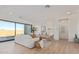 Bright and airy living room with a cozy seating area, natural light, and sliding glass doors at 2606 E Virginia Cir, Mesa, AZ 85213
