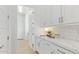 Well-organized pantry with white cabinets, ample counter space, and convenient access to storage at 2606 E Virginia Cir, Mesa, AZ 85213
