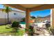 Backyard view from under the covered patio with an inground pool at 26066 N 72Nd Ave, Peoria, AZ 85383