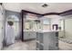 Stylish bathroom with a large vanity area, walk-in shower, and soaker tub at 26066 N 72Nd Ave, Peoria, AZ 85383