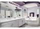 The updated bathroom features double sinks and soaking tub at 26066 N 72Nd Ave, Peoria, AZ 85383
