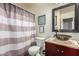 Bathroom featuring a sink with a vanity and an enclosed shower and toilet area at 26066 N 72Nd Ave, Peoria, AZ 85383