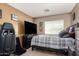 Bedroom with a television and a plaid blanket at 26066 N 72Nd Ave, Peoria, AZ 85383
