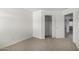 Bedroom features neutral carpeting and a closet with sliding doors at 26066 N 72Nd Ave, Peoria, AZ 85383