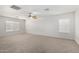 Bedroom featuring neutral carpeting, a ceiling fan, and natural light at 26066 N 72Nd Ave, Peoria, AZ 85383