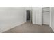 Bright bedroom features neutral carpet, closet, and entry doorway at 26066 N 72Nd Ave, Peoria, AZ 85383