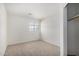 Bedroom features a window, neutral carpeting and a closet at 26066 N 72Nd Ave, Peoria, AZ 85383