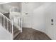 Welcoming foyer with a curved staircase, wood-look tile flooring, and bright lighting at 26066 N 72Nd Ave, Peoria, AZ 85383