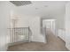Hallway with carpet floors, overhead lighting, and access to multiple rooms at 26066 N 72Nd Ave, Peoria, AZ 85383