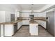 Well-lit kitchen boasts granite countertops, stainless appliances and a large island at 26066 N 72Nd Ave, Peoria, AZ 85383