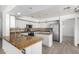 Well-lit kitchen featuring granite countertops, stainless steel appliances, and tile flooring at 26066 N 72Nd Ave, Peoria, AZ 85383