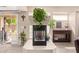 Cozy living room featuring a fireplace and access to the outdoor patio at 26066 N 72Nd Ave, Peoria, AZ 85383