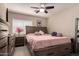 Spacious main bedroom with a large bed, and wood furniture at 26066 N 72Nd Ave, Peoria, AZ 85383