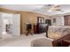 Spacious primary bedroom suite with large windows and ceiling fan at 26066 N 72Nd Ave, Peoria, AZ 85383
