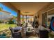 Covered patio featuring a seating area and a view of the pool at 26066 N 72Nd Ave, Peoria, AZ 85383