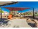 Community playground with swings and a slide located on a cement and mulch surface at 26066 N 72Nd Ave, Peoria, AZ 85383