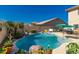Inviting backyard with a private pool, lush landscaping, and ample patio space at 26066 N 72Nd Ave, Peoria, AZ 85383