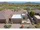 Aerial view of a single-Gathering home with a tile roof, a patio with outdoor furniture, and desert landscaping at 32835 N 70Th St, Scottsdale, AZ 85266
