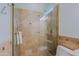 Spacious shower with glass door and small window for natural light at 32835 N 70Th St, Scottsdale, AZ 85266