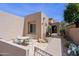 Charming courtyard featuring a patio table, seating area and vibrant desert plants and landscaping at 32835 N 70Th St, Scottsdale, AZ 85266