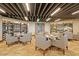 A dining room with modern lighting, walls of wine racks, and elegant tables and chairs at 32835 N 70Th St, Scottsdale, AZ 85266