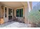 Cozy entrance featuring a security screen door, desert plants and stone walkway to the main door at 32835 N 70Th St, Scottsdale, AZ 85266