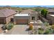 Stunning exterior view of the home with a desert landscape and a two car garage at 32835 N 70Th St, Scottsdale, AZ 85266