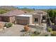 Aerial view of a tan single-Gathering home featuring a tile roof, desert landscaping, and a paved driveway at 32835 N 70Th St, Scottsdale, AZ 85266