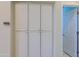 Hallway featuring white cabinets with a door leading into another room at 32835 N 70Th St, Scottsdale, AZ 85266