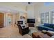 Open-concept living room featuring a fireplace, luxury floors, with an entrance into the dining area at 32835 N 70Th St, Scottsdale, AZ 85266