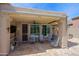 Covered outdoor patio with comfortable seating and a ceiling fan for year-round enjoyment at 32835 N 70Th St, Scottsdale, AZ 85266
