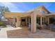 Spacious outdoor patio includes a grill, TV, retractable awning, and comfortable seating at 32835 N 70Th St, Scottsdale, AZ 85266