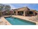 Inviting pool with stone surround and outdoor seating, perfect for relaxing or entertaining at 32835 N 70Th St, Scottsdale, AZ 85266