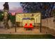 Cozy backyard cabana with a comfortable lounge area, decorative lighting, and a tranquil setting at 3473 E Wyatt Way, Gilbert, AZ 85297