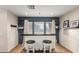 Stylish bar area features white cabinetry, a wood countertop, and stools for seating, perfect for entertaining guests at 3473 E Wyatt Way, Gilbert, AZ 85297