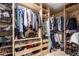 Custom walk-in closet with ample storage; drawers, shelves, rods, and organized compartments; perfect for wardrobe and accessories at 3473 E Wyatt Way, Gilbert, AZ 85297