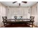 Dining room features a large dark wood table with a bench, creating a cozy and inviting atmosphere for meals at 3473 E Wyatt Way, Gilbert, AZ 85297