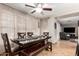 Open dining area with a large dark wood table and bench seating, perfect for Gathering meals and entertaining at 3473 E Wyatt Way, Gilbert, AZ 85297