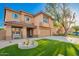 Two-story home showcasing an attractive facade, manicured lawn, and a welcoming covered porch at 3473 E Wyatt Way, Gilbert, AZ 85297