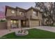 Two-story home showcasing an attractive facade, manicured lawn, and a welcoming covered porch at 3473 E Wyatt Way, Gilbert, AZ 85297