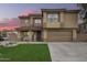 Two-story home showcasing an attractive facade, manicured lawn, and a welcoming covered porch at 3473 E Wyatt Way, Gilbert, AZ 85297